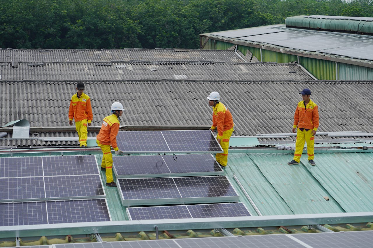 The Art of Drawing Readers In: Your attractive post title goes here Workers installing solar panels on a roof for sustainable energy solutions.